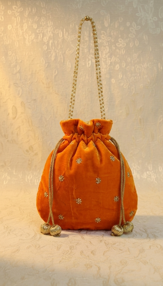 Orange velvet potli bag